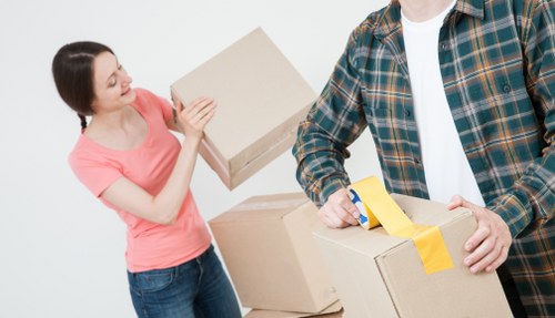 Furniture removals team handling a sofa move in Streatham
