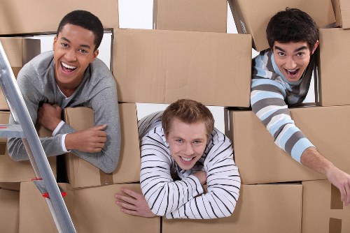 Packed office boxes and furniture ready for relocation in South London