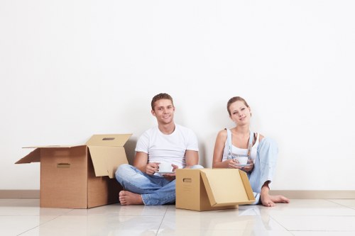 Unpacking boxes in a Streatham flat with organised room setup