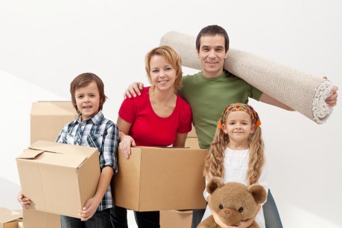Careful loading of boxes into a van using safe handling practices