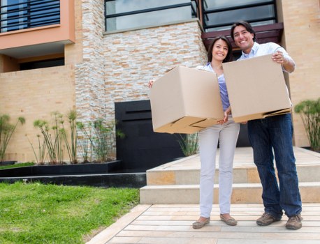Removal team carrying student furniture from a Streatham flat